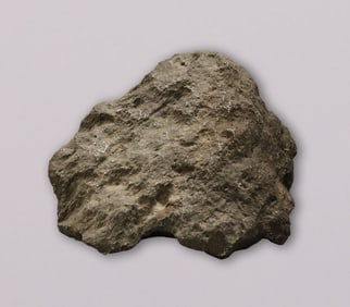 A heavy meteorite like boulder