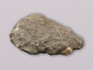A heavy meteorite like boulder