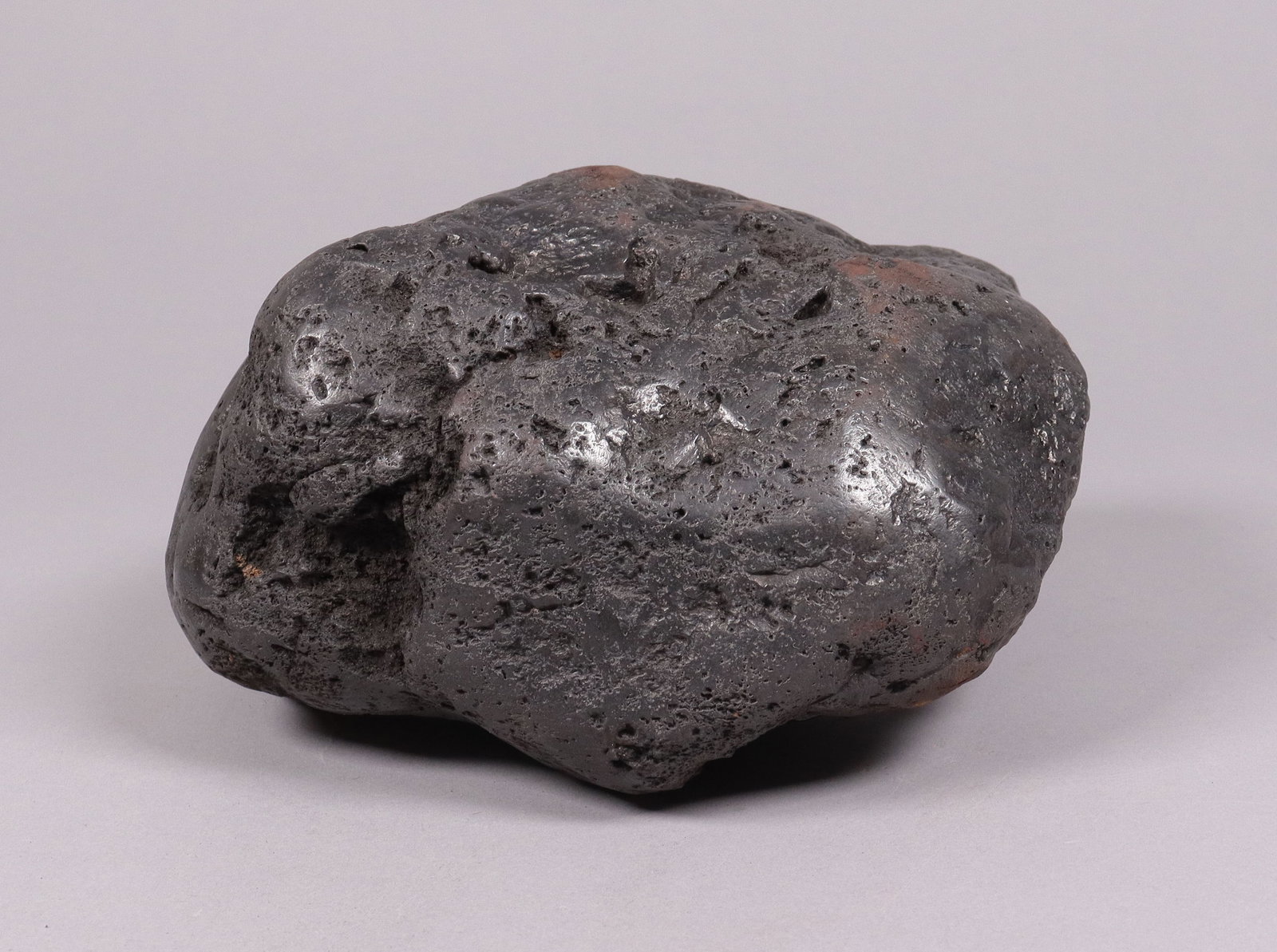A possible meteorite boulder: A possible meteorite boulder, condition selling it as is. All sales are final. No return. H: 4.5" x W: 9." Total weight 16.05 lb.