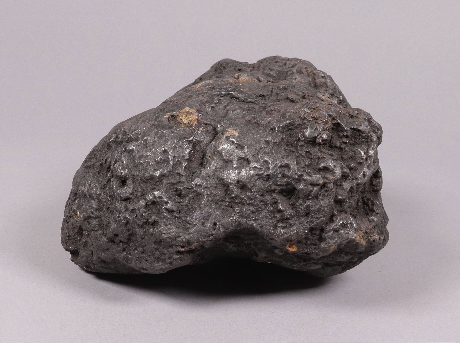 A possible meteorite boulder: A possible meteorite boulder, condition selling it as is. All sales are final, no return. H: 4.5" x W: 6.5." Total weight 12.55 lb.