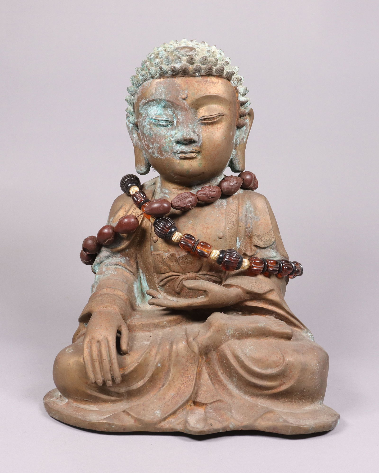 Chinese buddha statue with beads: Chinese buddha statue with beads, from an estate. H: 14" x W: 12."
