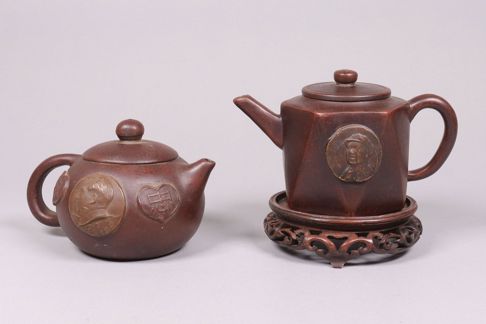 2 Chinese clay teapots: 2 Chinese clay teapots. Largest H: 4" x W: 7."