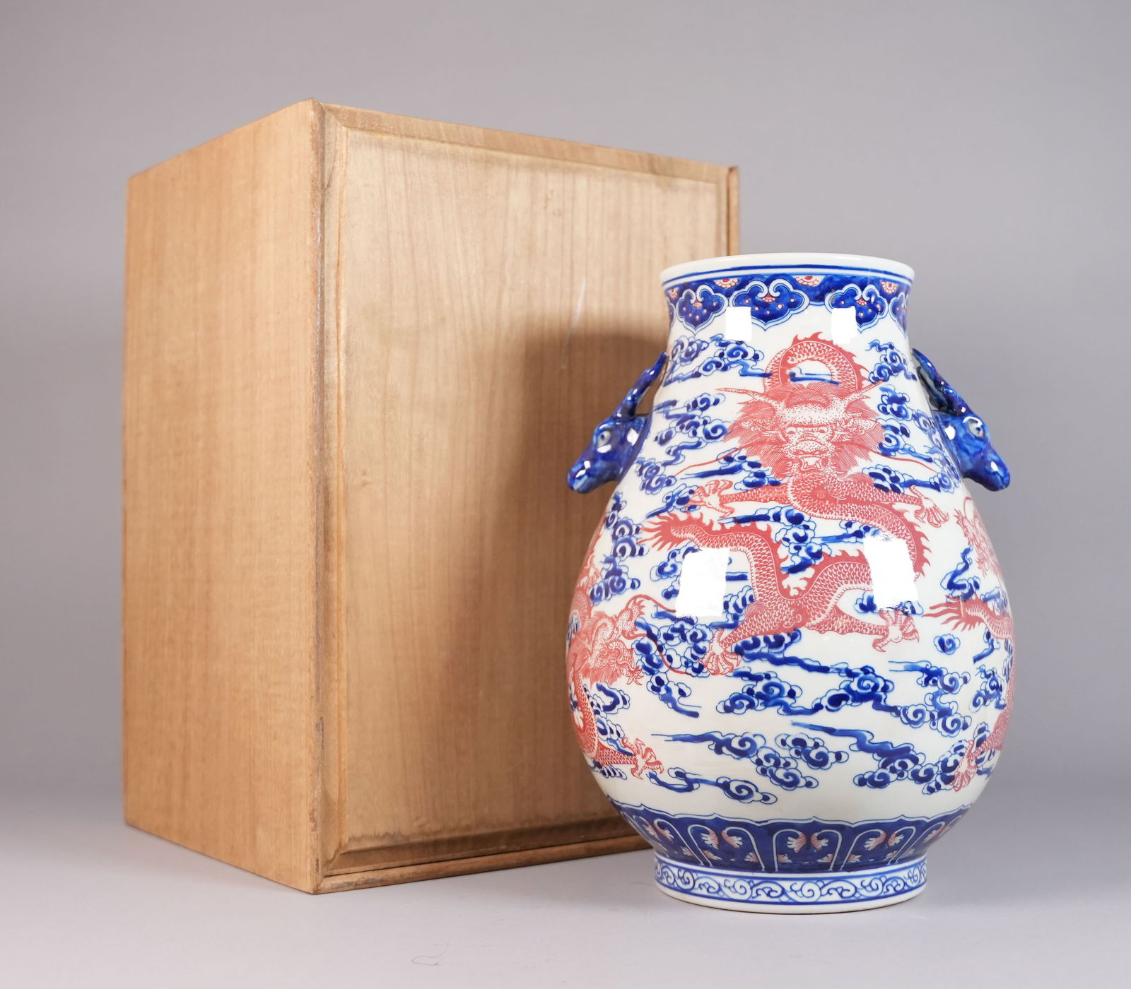 Chinese dragon urn vase with box: Chinese dragon urn vase with wooden box. H: 13" x W: 11."