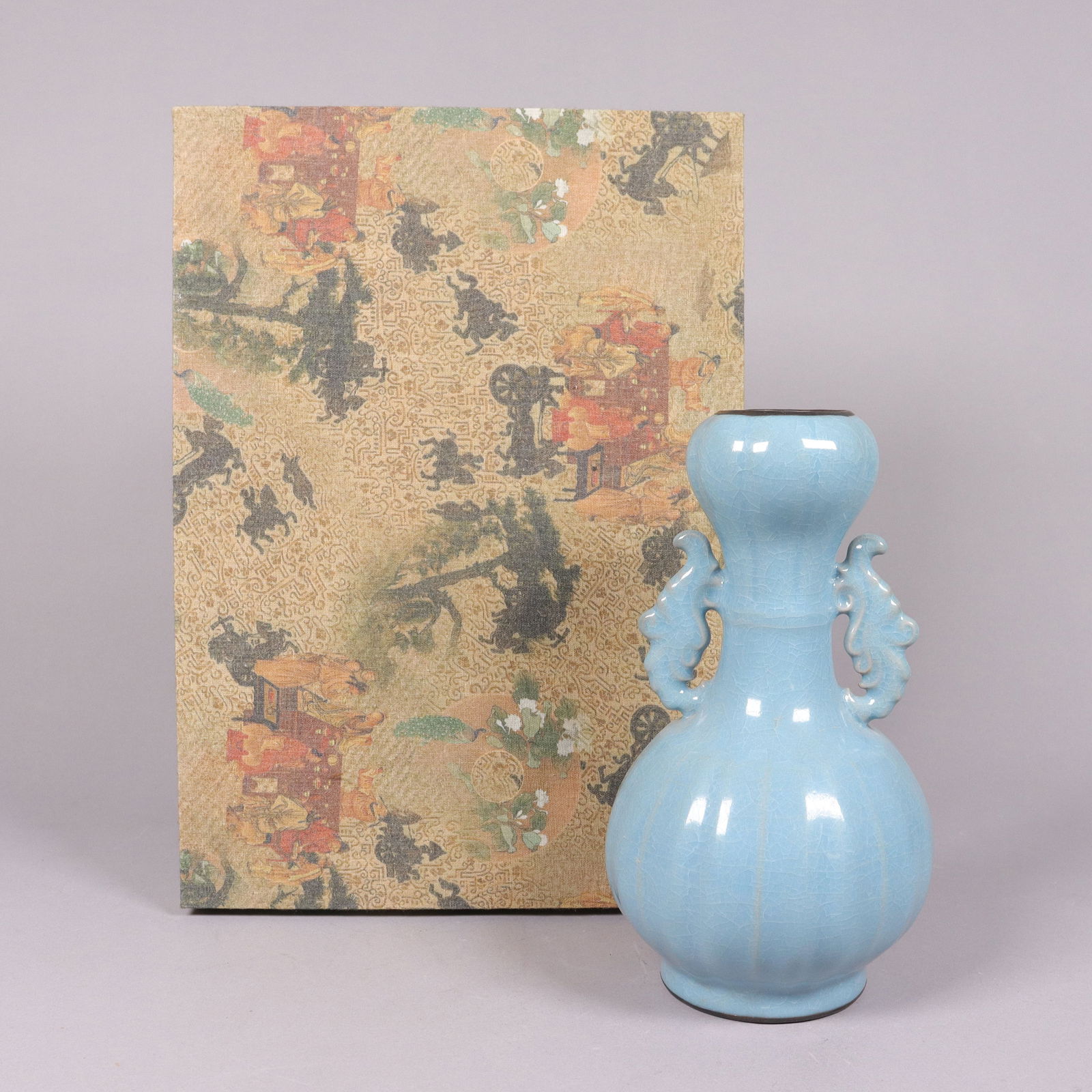 Chinese fine celadon vase with silk box: Chinese fine celadon vase with silk box. H: 9" x W: 5."