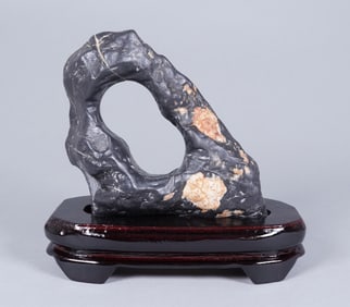 A heavy fine boulder on stand