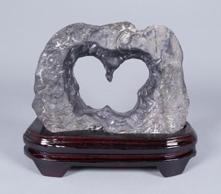 A heavy fine boulder on stand