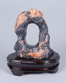 A heavy fine boulder on stand