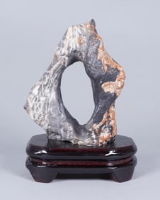 A heavy fine boulder on stand