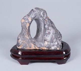 A heavy fine boulder on stand