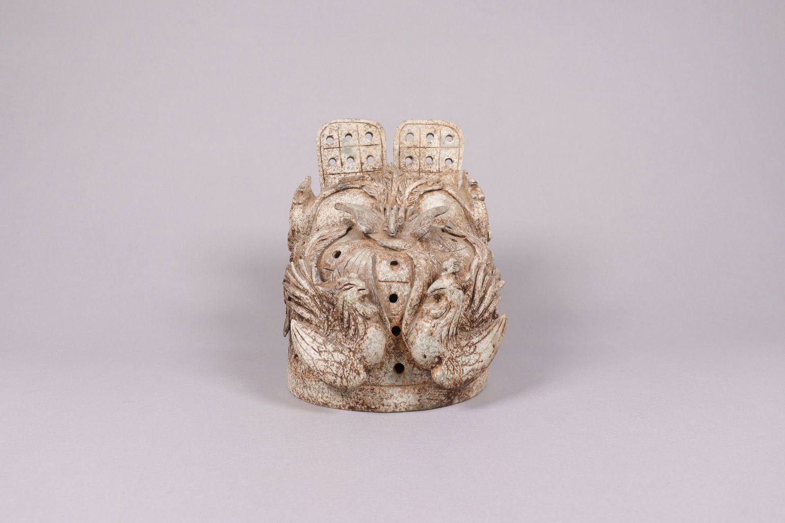 An asian carved figure: An asian carved figure. H: 8.25" x W: 6.15."