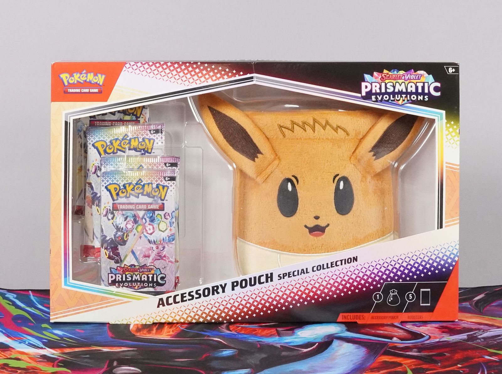 5 Pokemon Prismatic seald packs: 5 Pokemon Prismatic sealed packs, and a pouch.