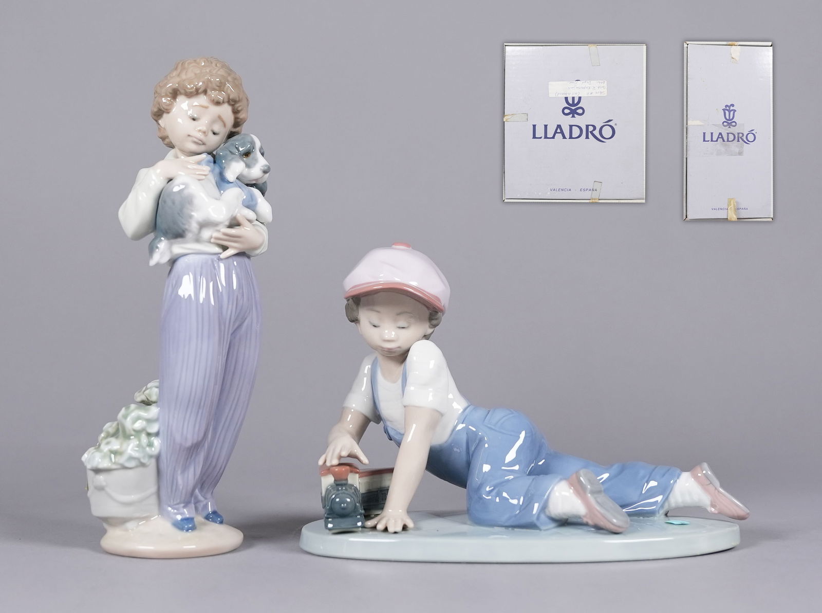 2 Lladro figurines with box: 2 Lladro figurines with box. Largest H: 5" x W: 7."