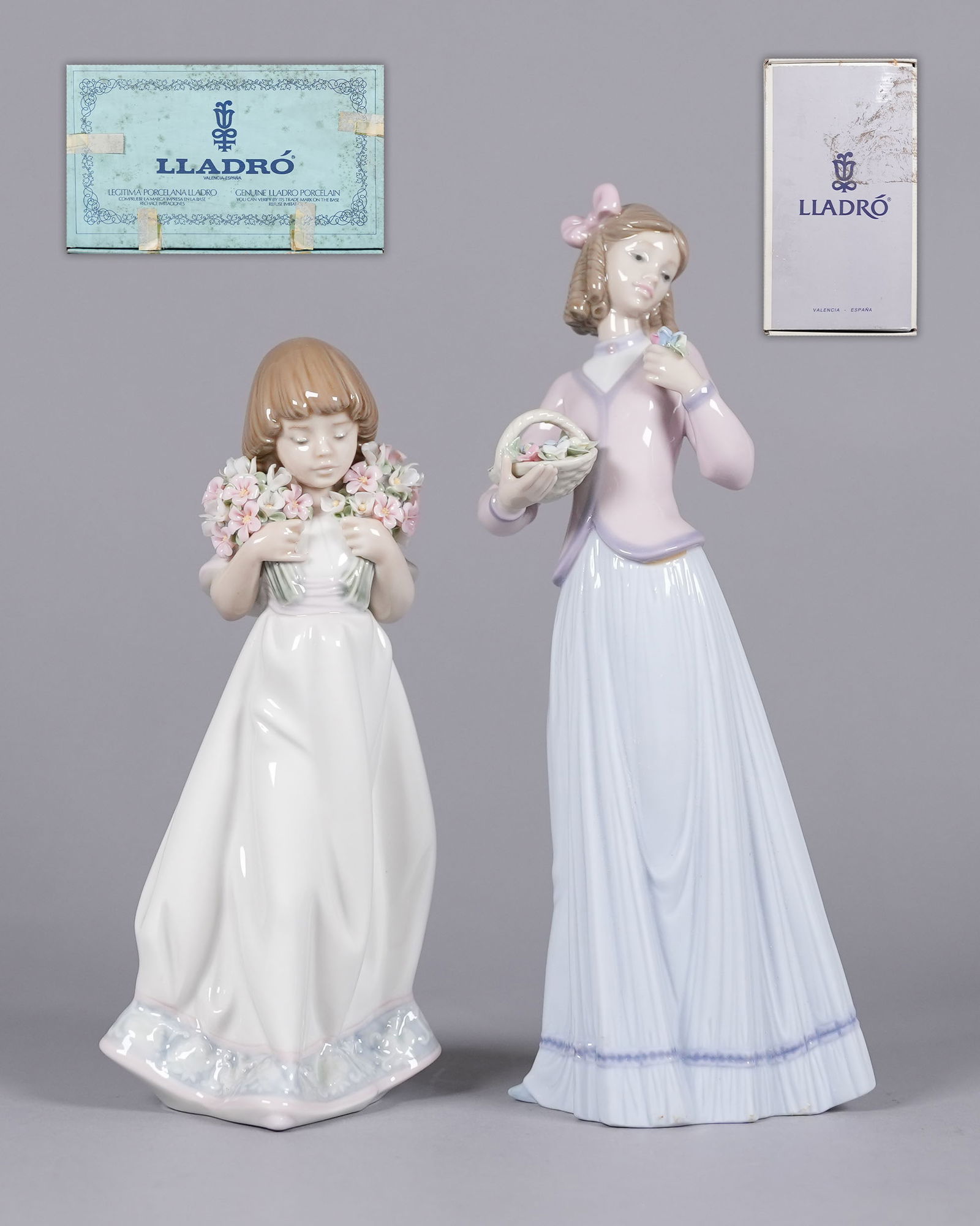 2 Lladro figurines with box: 2 Lladro figurines with box. H: 9.5" x W: 4."