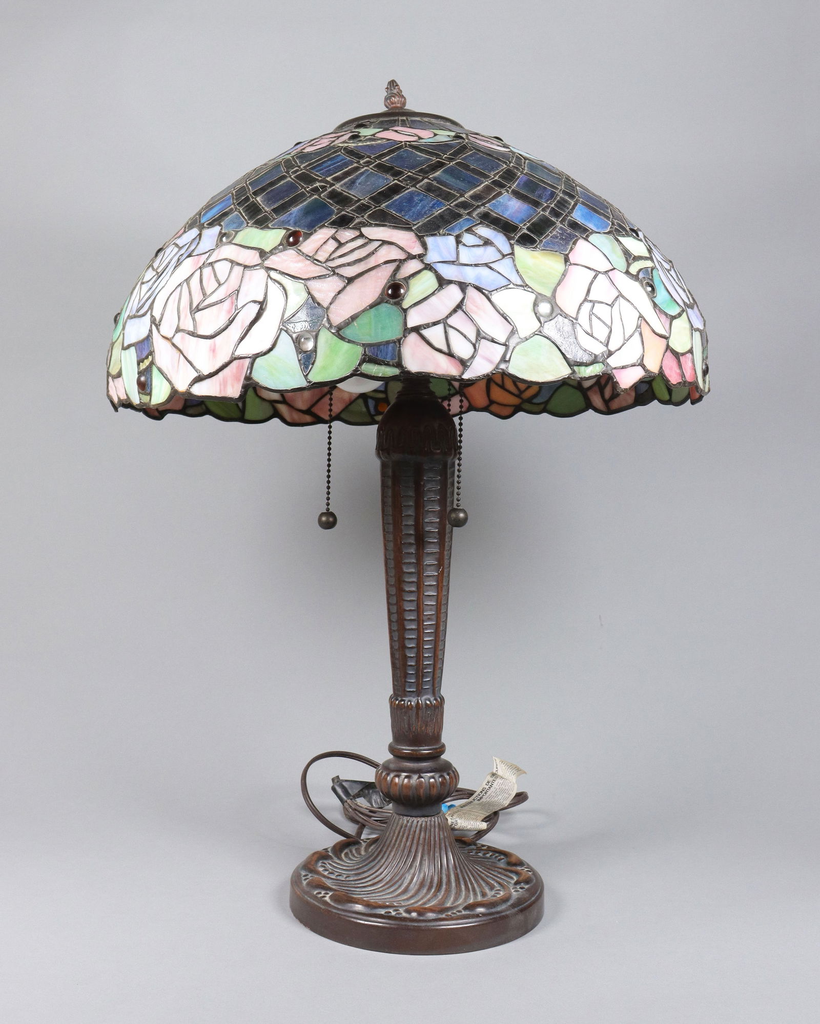 A Tiffany style lamp: A vintage Tiffany style lamp. H: 26" x W: 20."