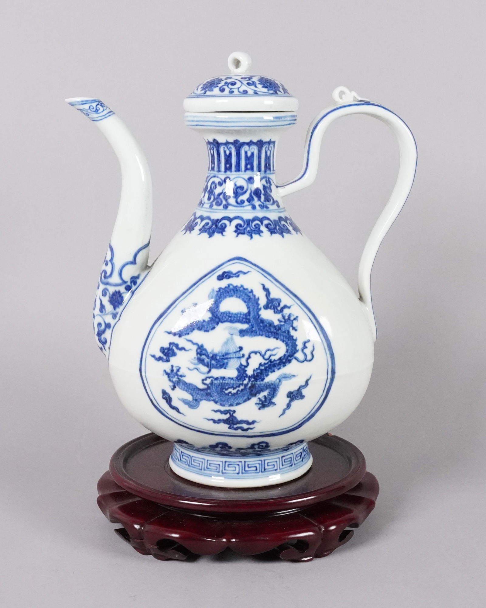 Chinese fine b/w dragon ewer: Chinese fine blue and white dragon ewer. H: 10.5" x W: 8.2."