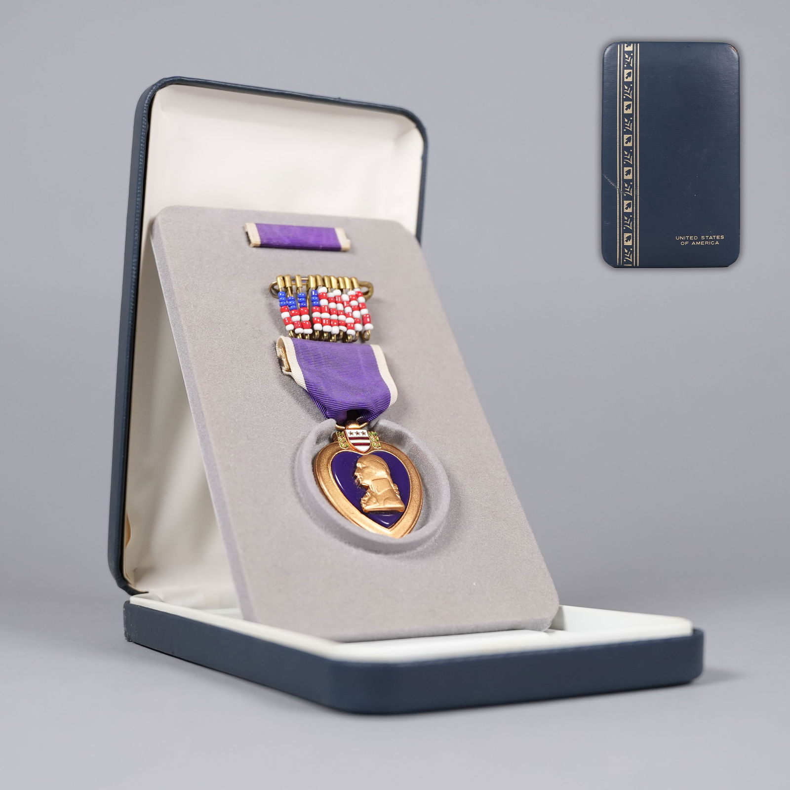 A rare WWII Purple Heart with case: A rare WWII U.S. Purple Heart with original presentation case box. Comes with documentations.