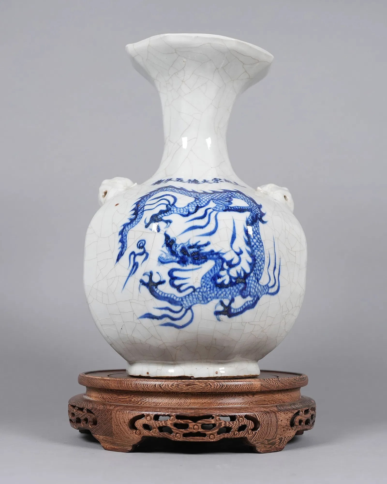 Chinese tall crackled b/w vase: Chinese tall fine crackled blue and white vase. H: 12" x W: 8.6."