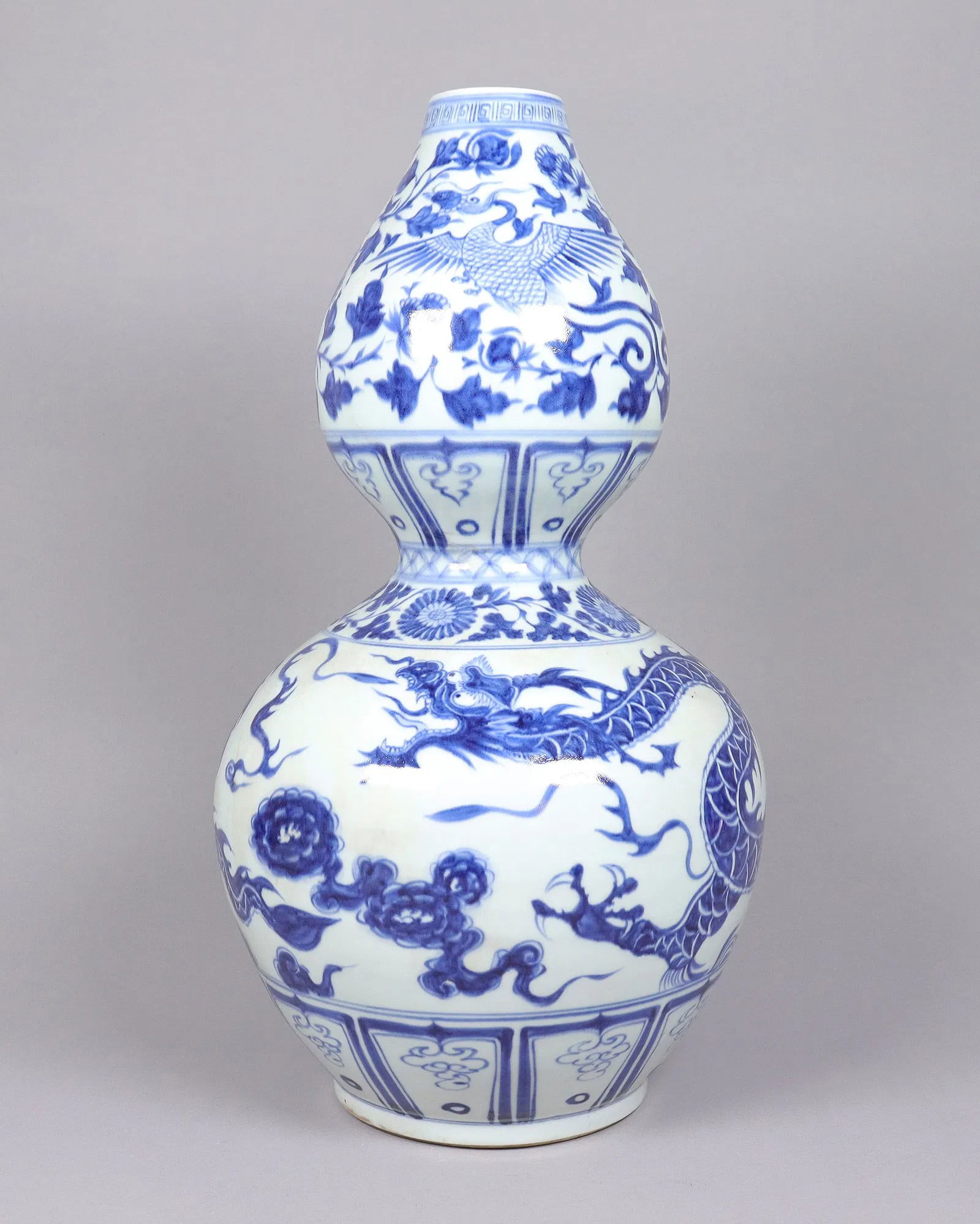 Chinese tall b/w gourd vase: Chinese tall blue and white fine gourd vase. H: 19" x W: 9."