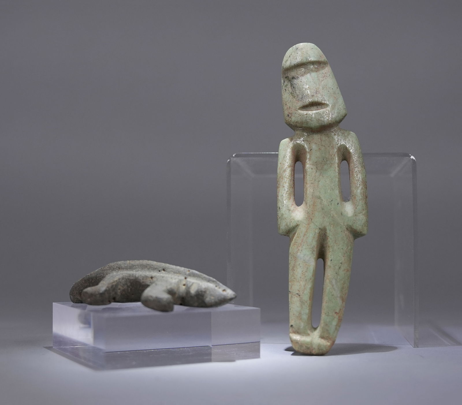 2 Important Olmec man beast figure: 2 Important Olmec jade man figure and beast figure celt. From a major estate.