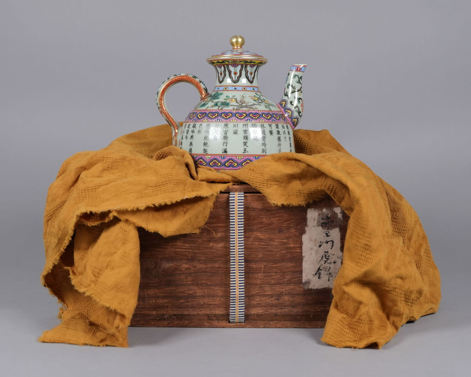 Chinese fine teapot with container: Chinese fine porcelain teapot, with wrapped and container. From a major provenance estate. H: 5.2" x W: 5.6."
