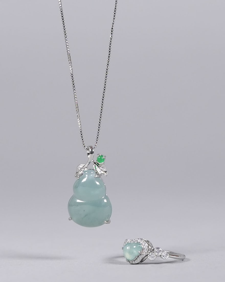 Chinese sterling natural jadeite items: Chinese sterling natural jadeite items. From an estate.