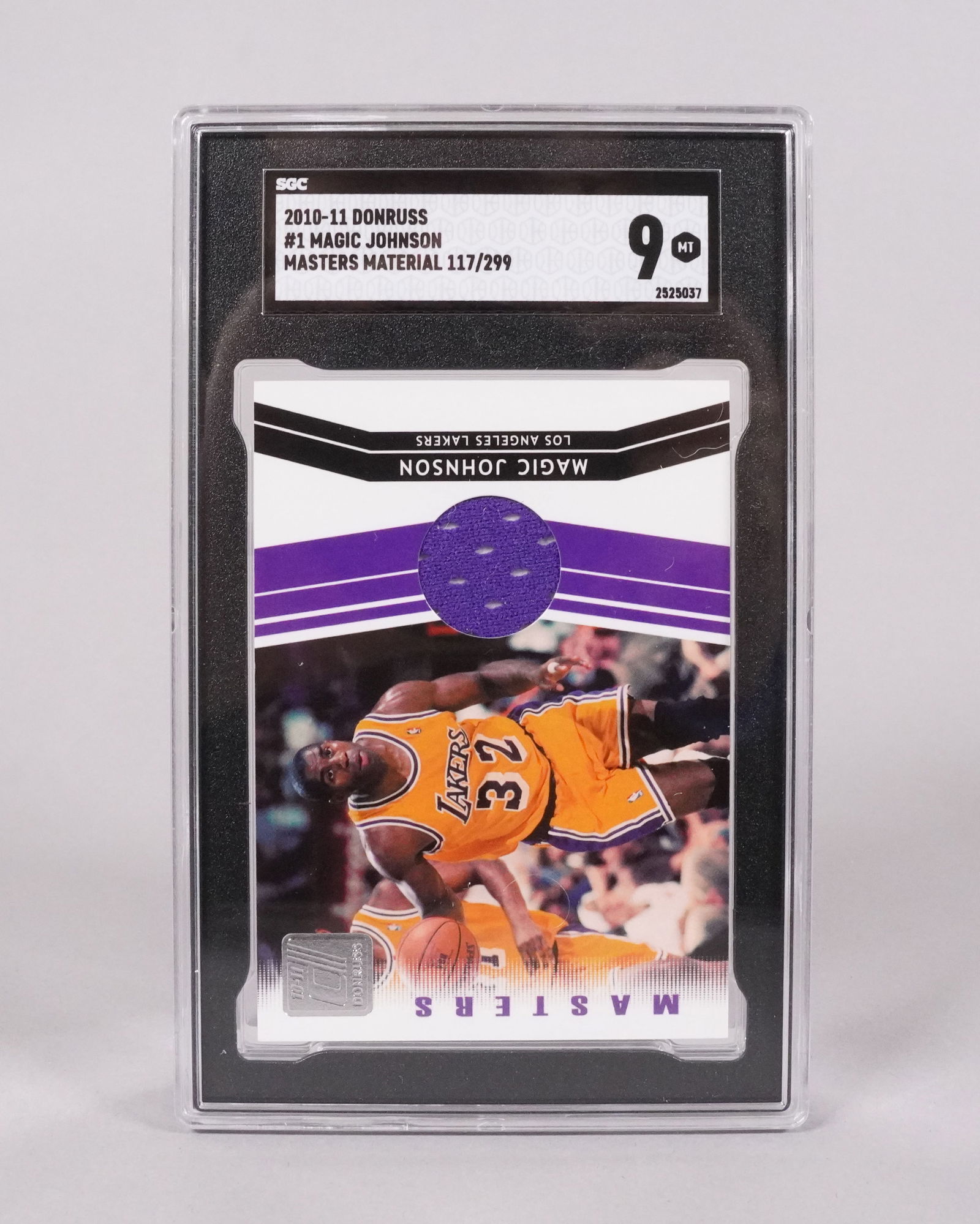 Magic Johnson relic card SGC 9: Magic Johnson relic card, SGC 9.
