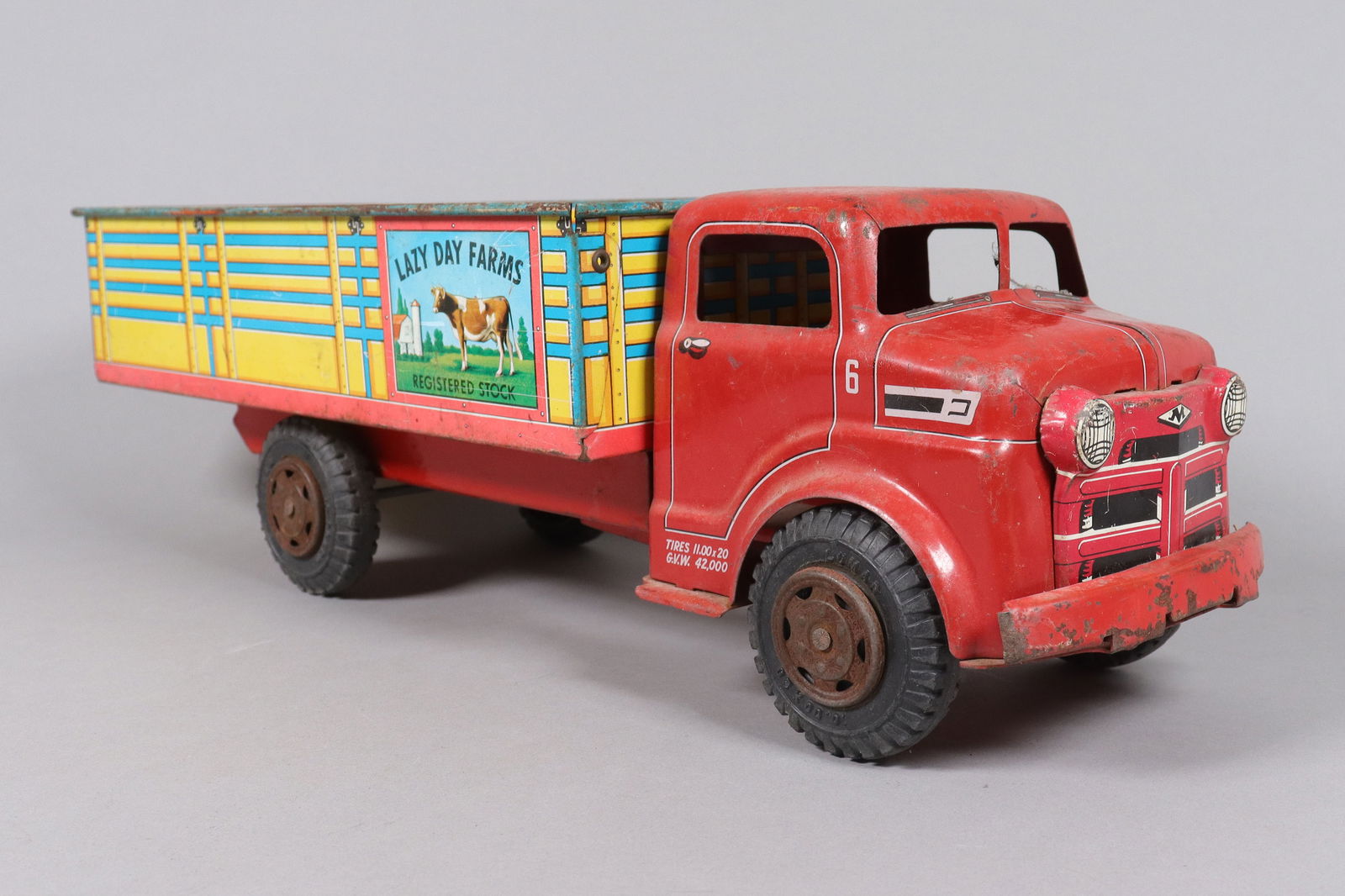 A vintage metal truck toy: A vintage metal truck toy. H: 5.5" x W: 17.85."