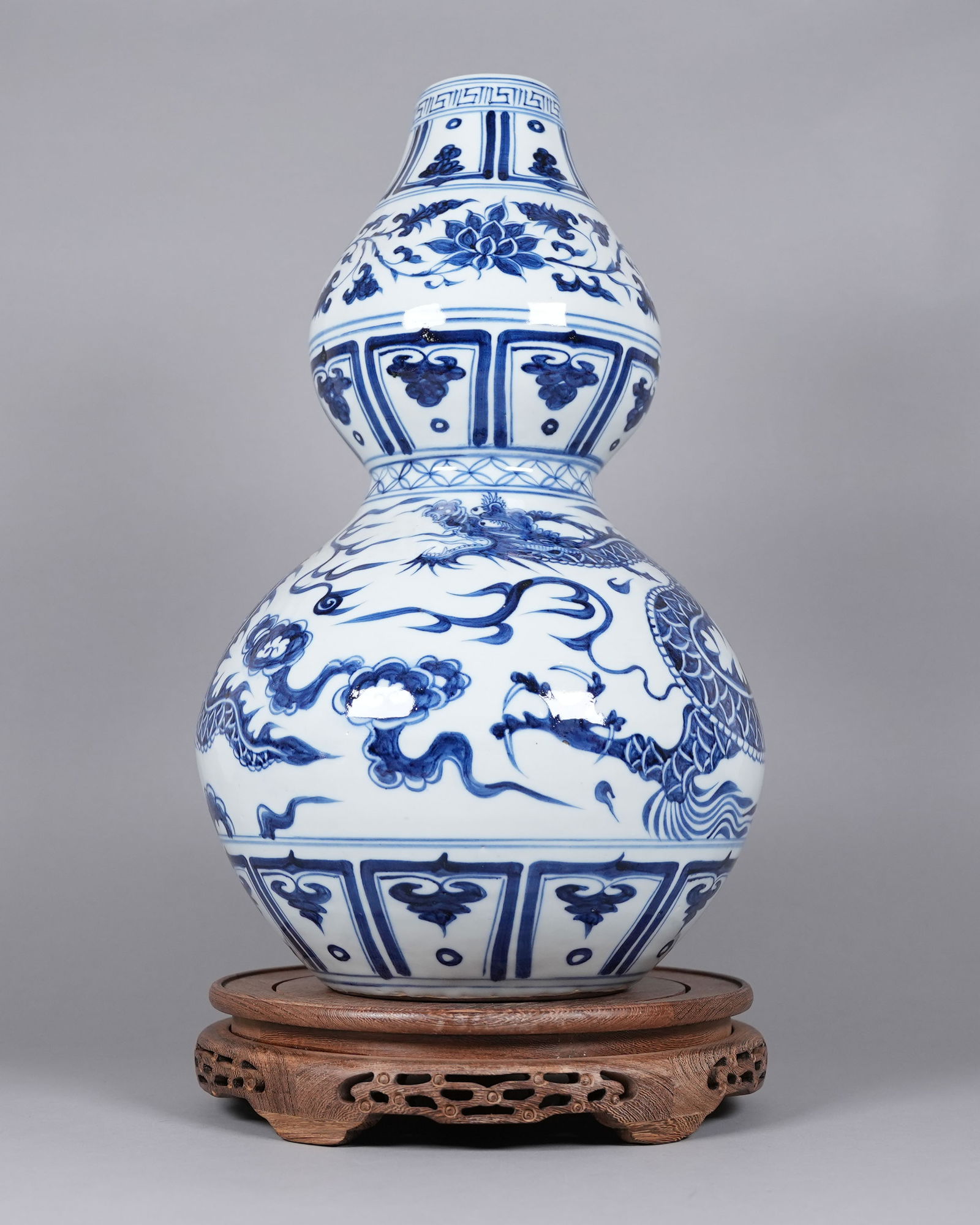 Chinese large b/w dragon gourd vase: Chinese large blue and white dragon gourd vase. H: 18" x W: 10.5."