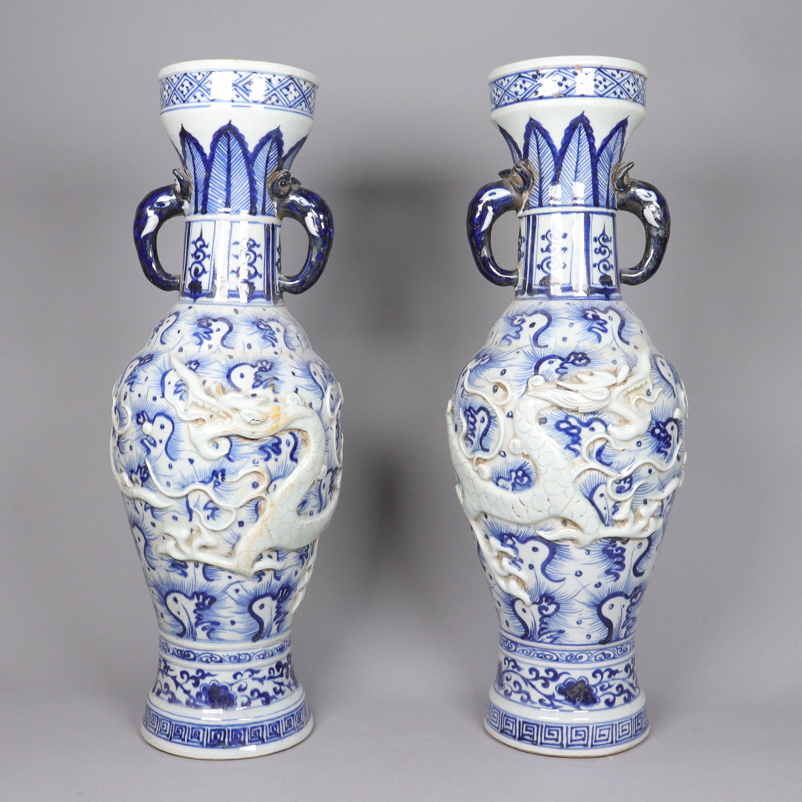 2 Chinese massive dragon vase: 2 Chinese massive dragon vase. H: 22.75" x W: 8."