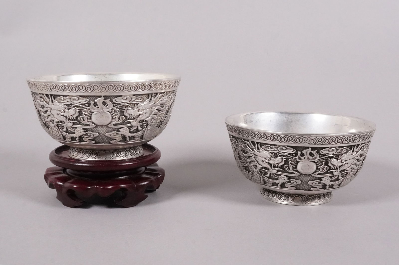 2 Chinese fine dragon bowls: 2 Chinese fine carved dragon bowls. Largest H: 2.25" x W: 4.75."