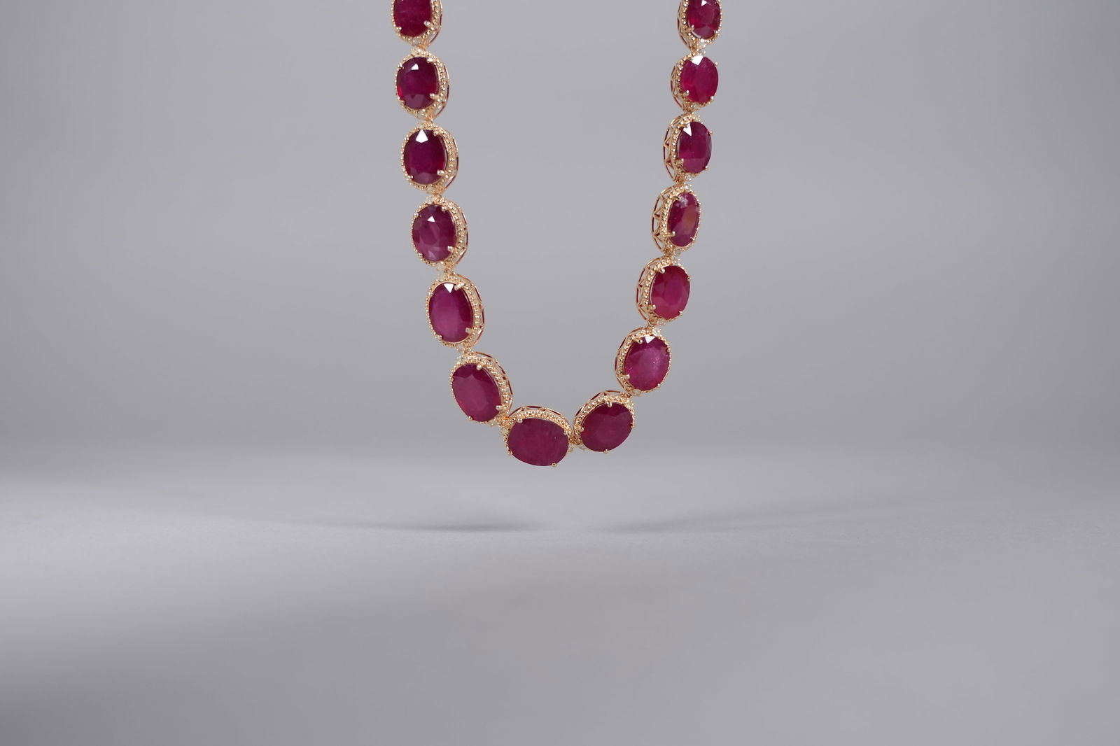 Sterling with white gold ruby diamond necklace: Sterling .925 with yellow gold overlay natural ruby and diamond necklace. Total 187.28 carats ruby. Total 2.79 carats diamonds.