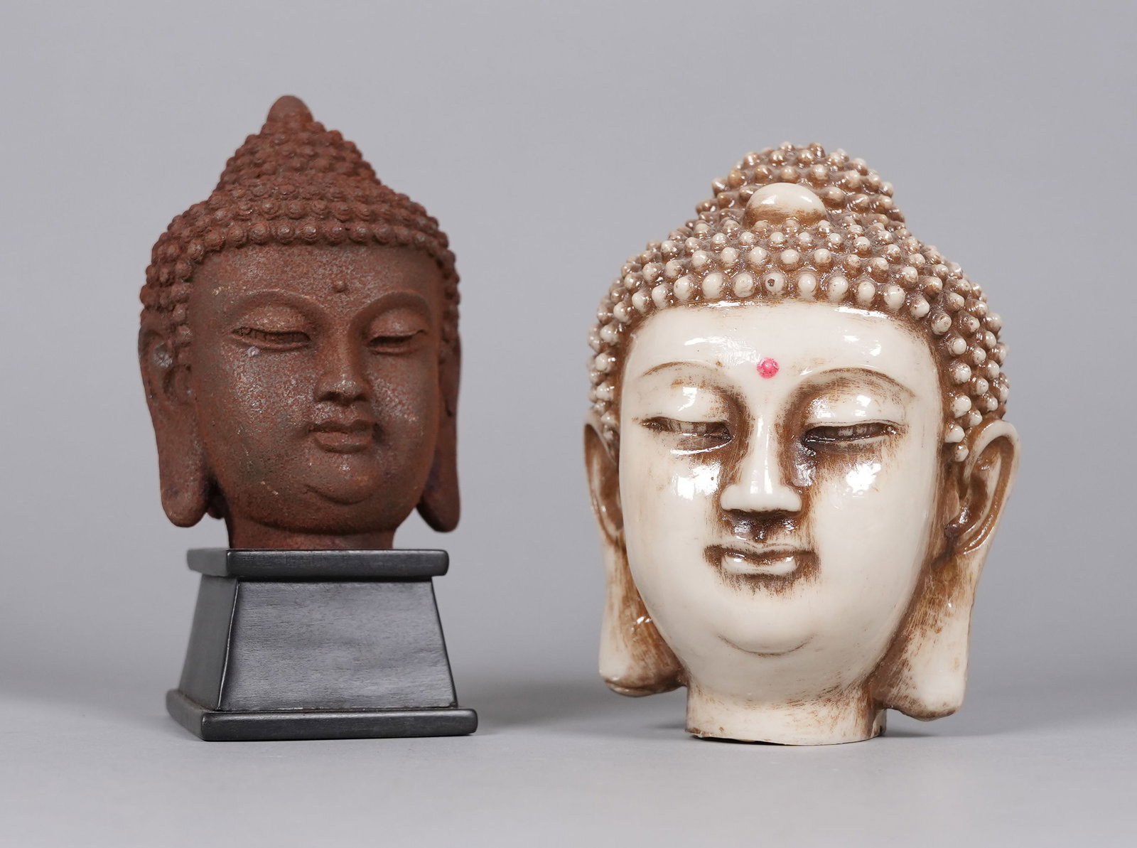 Lots Chinese buddha heads: Lots Chinese buddha heads. Largest H: 5.8" x W: 4.5."