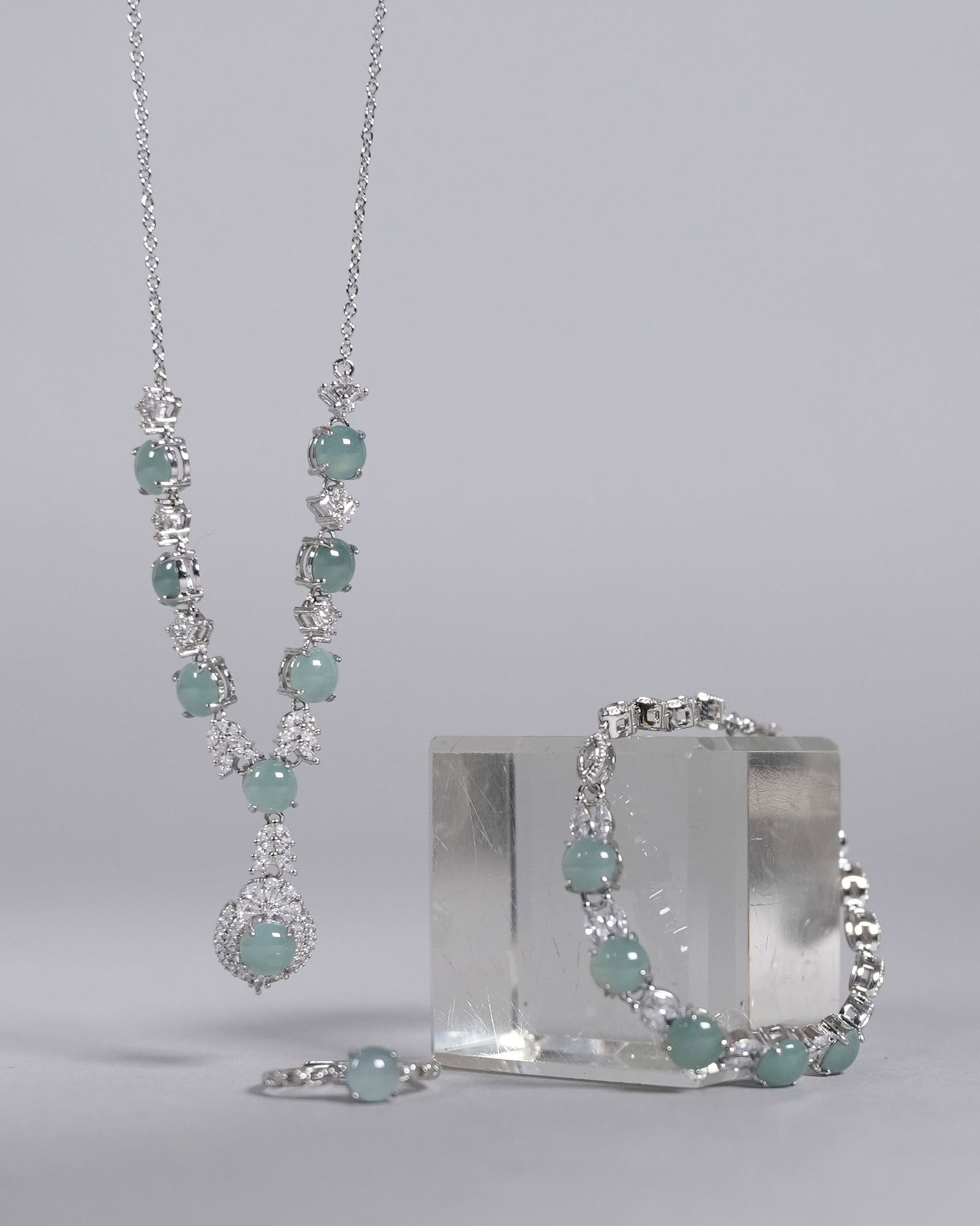 A set of sterling natural jadeite items. One is a necklace, ring, and bracelet. (1 of 7)