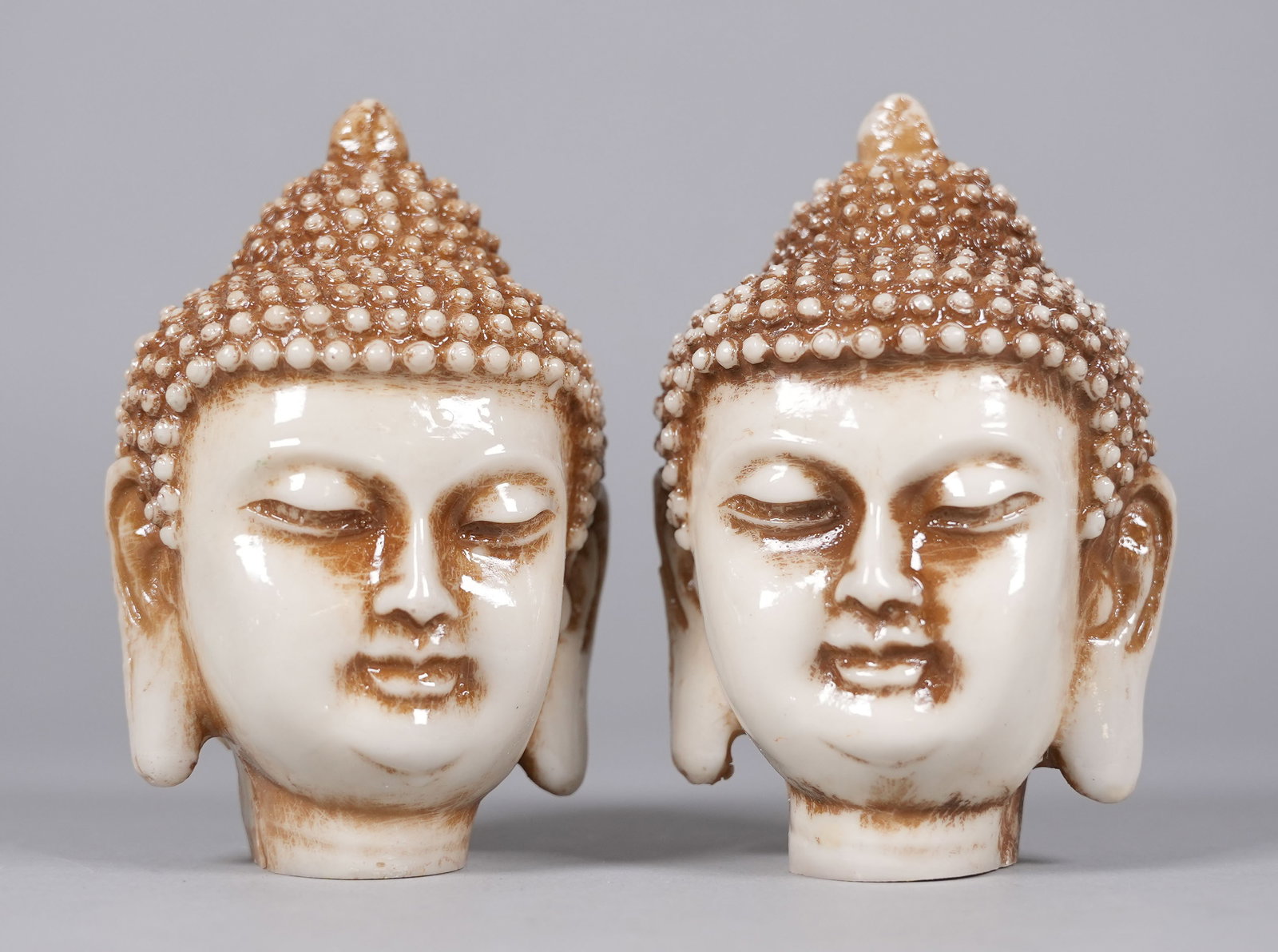 2 Chinese fine buddha heads. H: 5.5" x W: 3.5." (1 of 7)