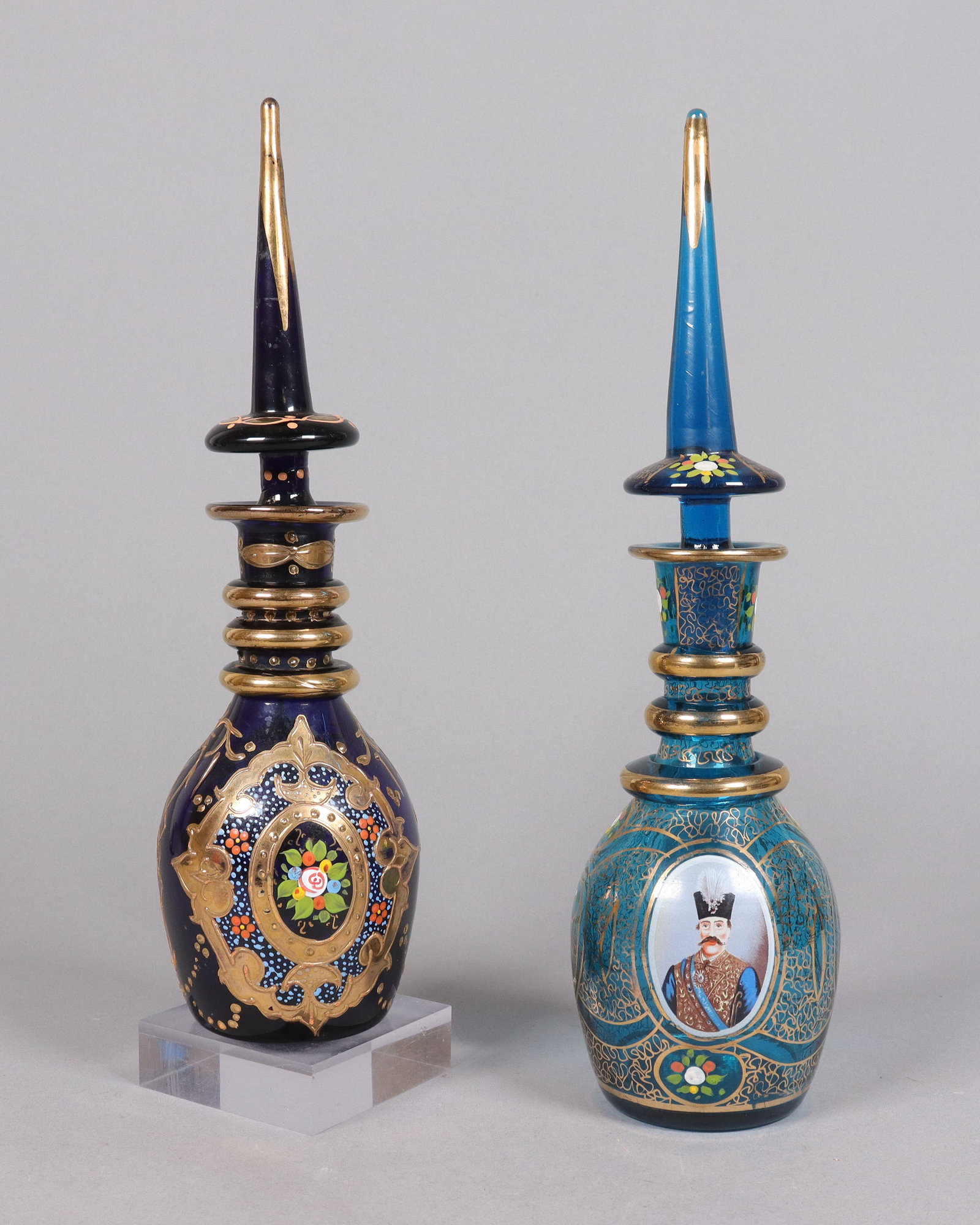 2 Bohemian glass fine bottles: 2 vintage Bohemian glass fine bottles. H: 12.75" x W: 3.5."