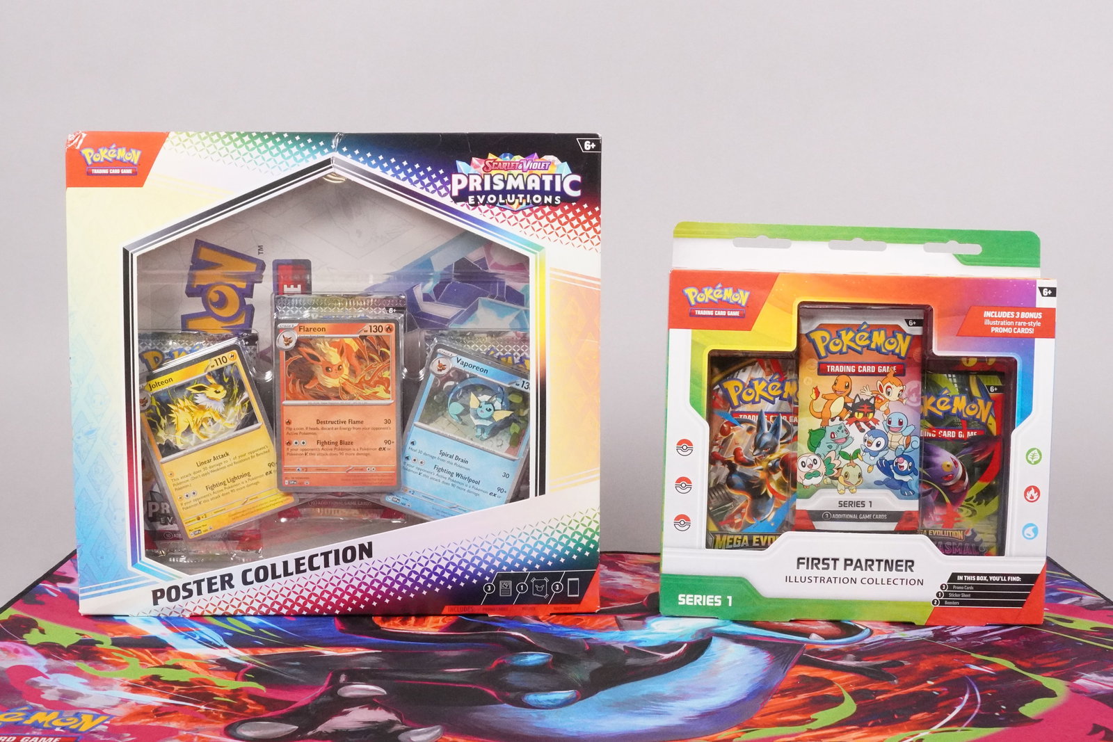 Pokemon Prismatic and First Partner sealed packs: Lots Pokmeon Prismatic sealed packs and Pokemon First Partner sealed packs.
