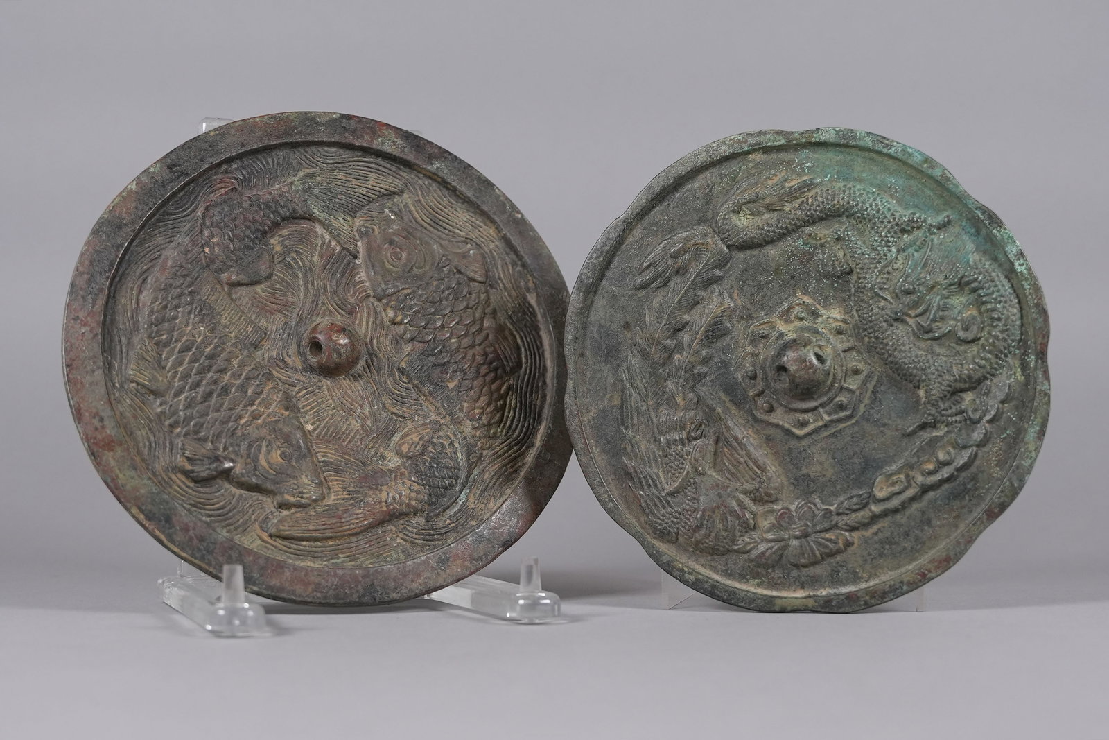 2 Chinese bronze mirrors: 2 Chinese fine bronze mirrors. H: 0.2" x W: 8.1."
