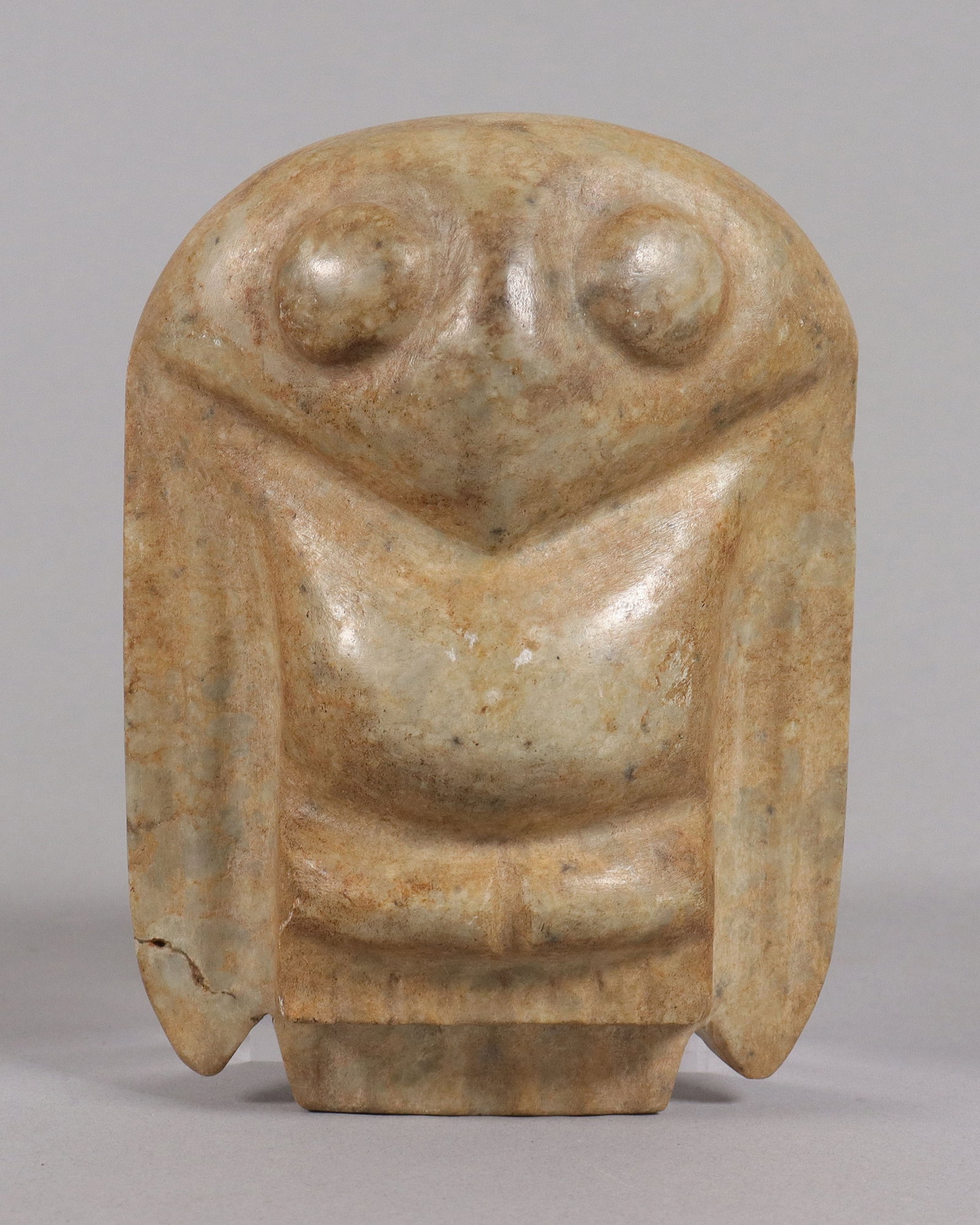 An important Pre-Columbian celt: An important Pre-Columbian carved celt. H: 6" x W: 4.75." From a major estate.
