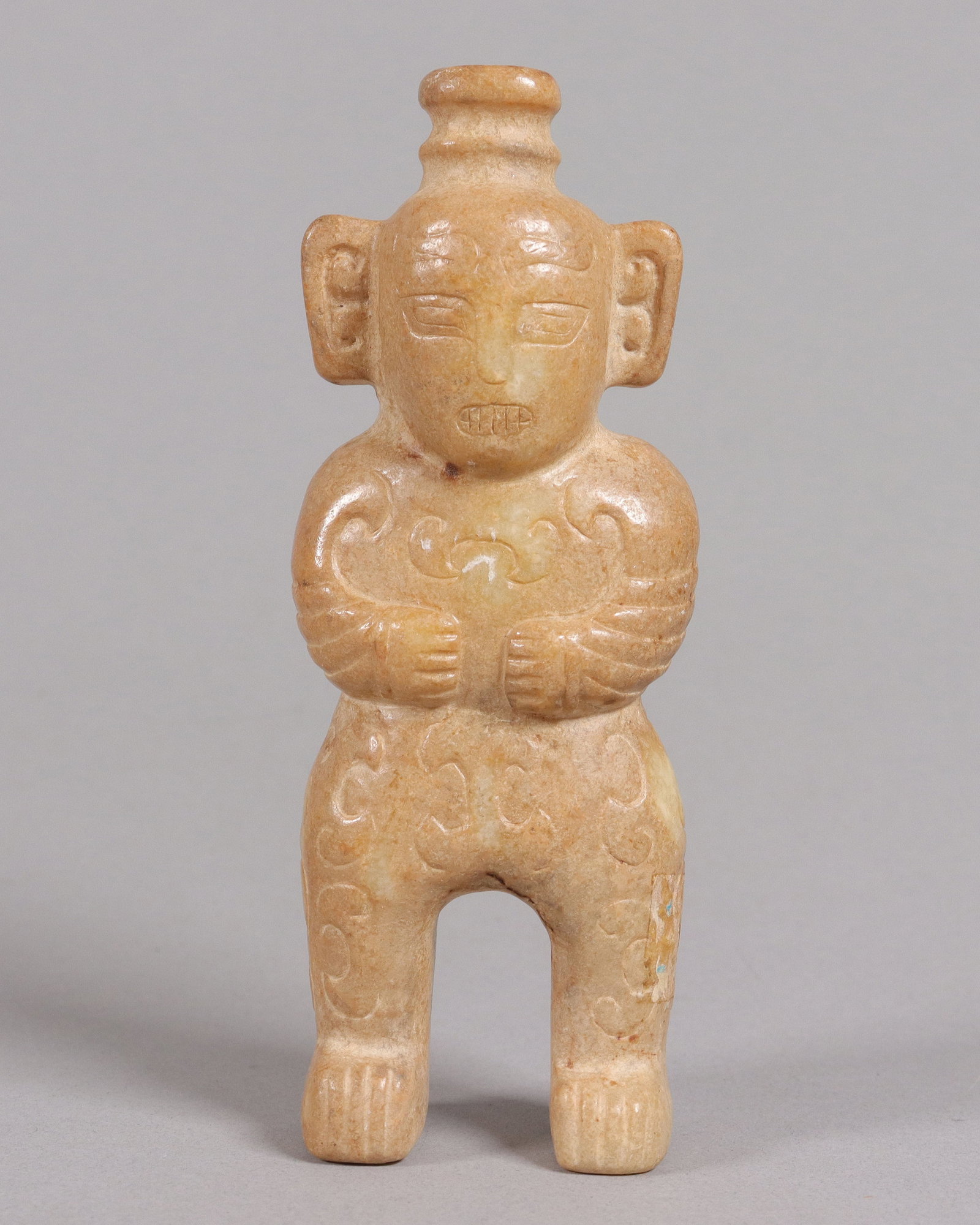Pre-Columbian fine carved celt: Pre-Columbian fine carved celt, figure of a man. H: 5.75" x w: 2.25."