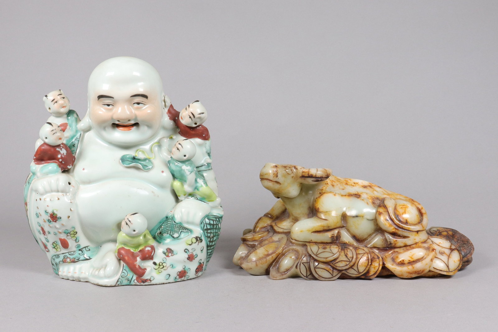 Chinese fine buddha and carved ox: Chinese fine porcelain buddha and heavy carved ox. Largest H: 5" x W: 10.5."