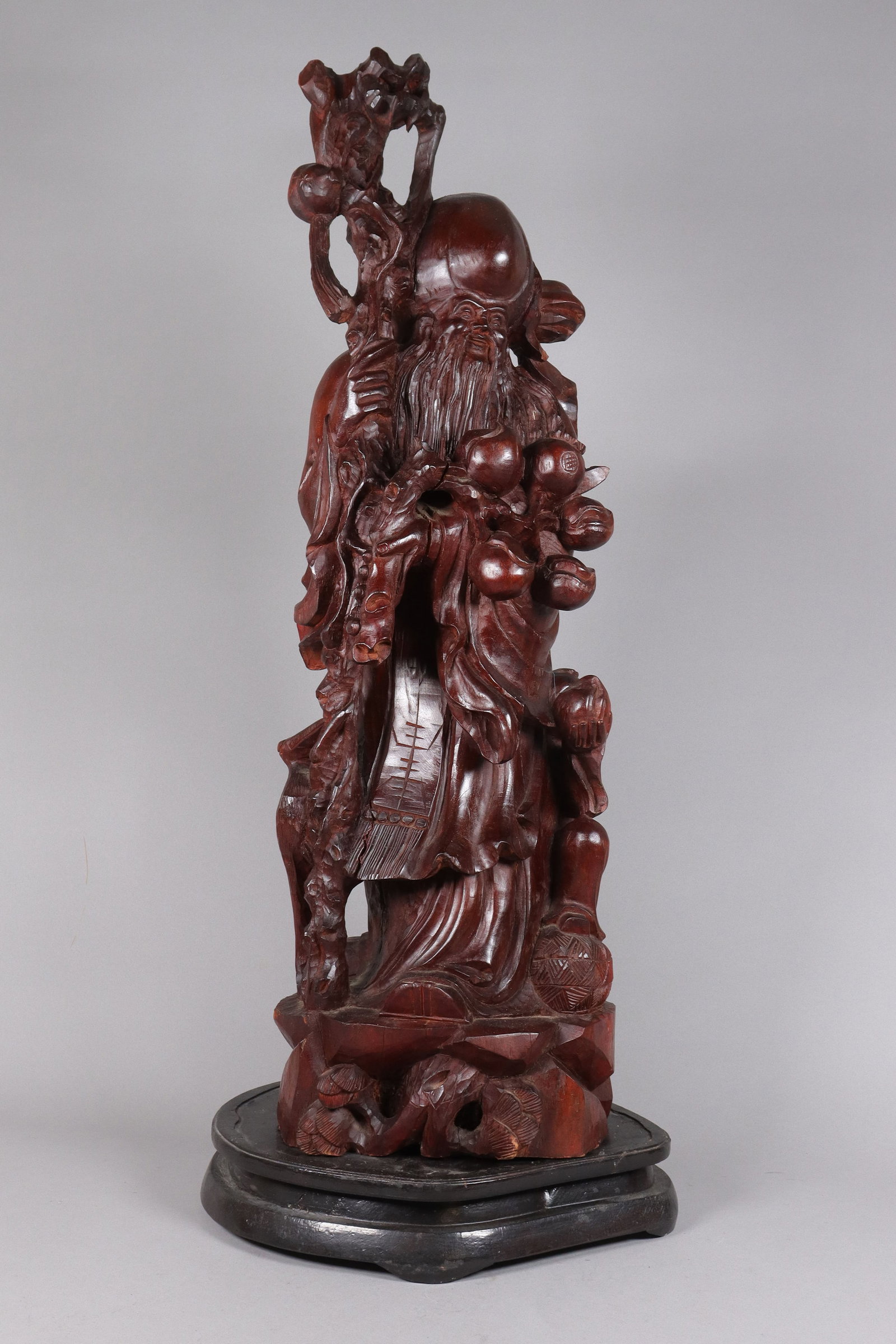 Chinese fine heavy wooden immortal figure: Chinese fine heavy wooden carved immortal figure. Condition selling it as is. H: 32" x W: 10."