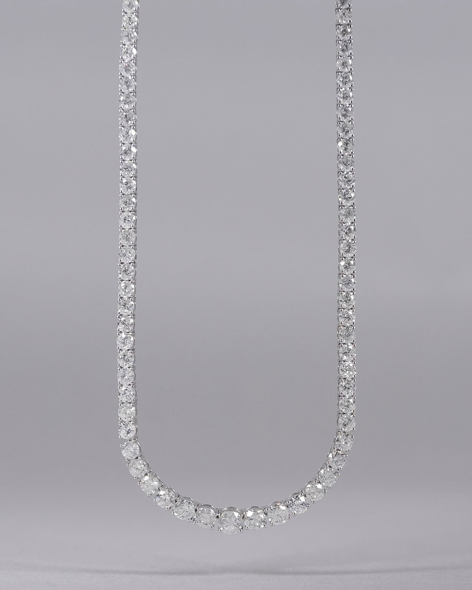 14 kt w/g natural diamond necklace 32.36 carats: 14 kt white gold natural diamonds necklace. Total 103 diamonds and total 32.36 carats. Total appraisal value $129,856. From a major estate.
