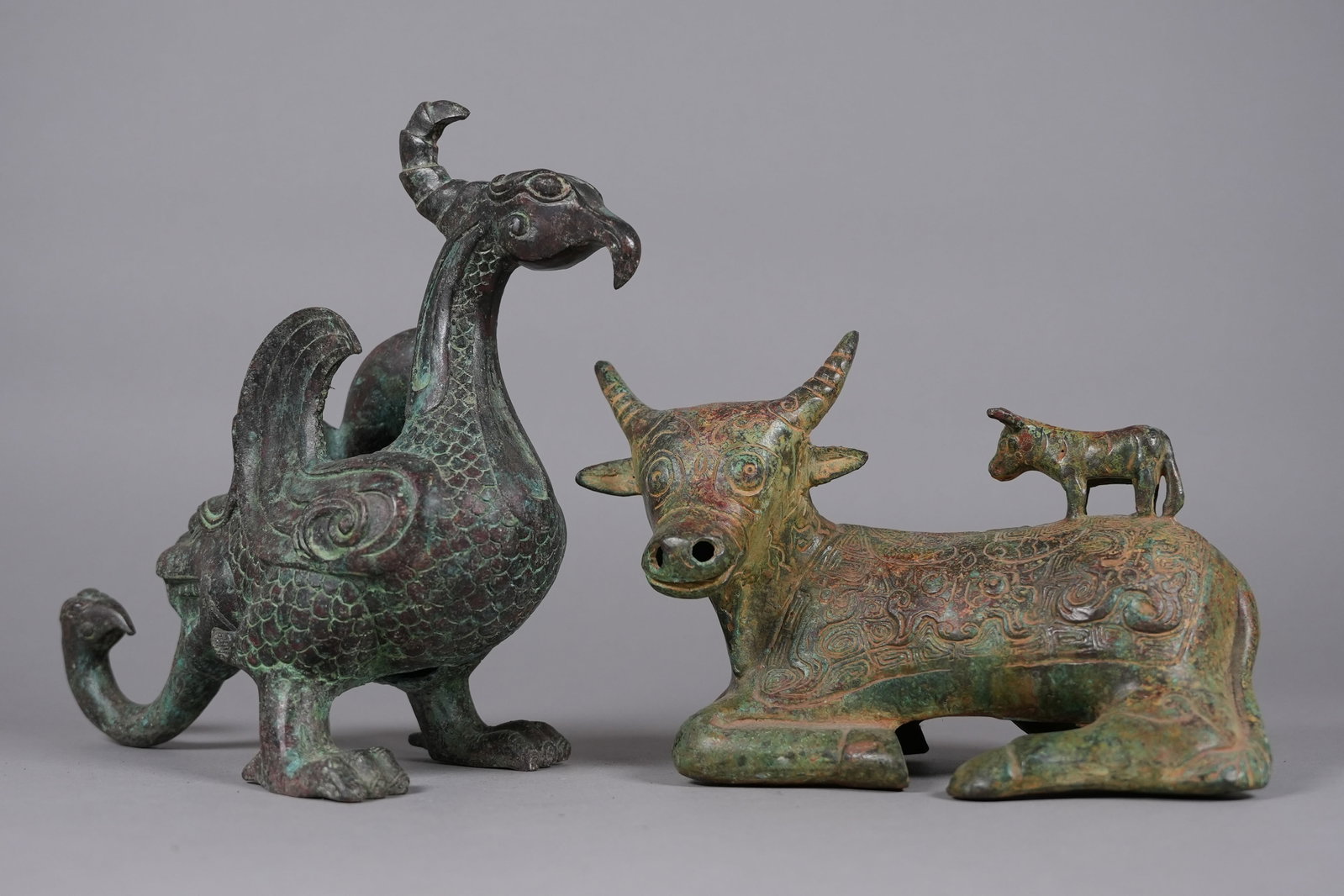 2 Chinese bronze vessels: 2 Chinese bronze carved vessels. Largest H: 6.75" x W: 9.5."