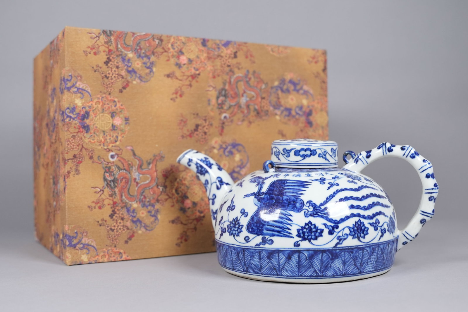 Chinese b/w fine porcelain pot with box: Chinese fine blue and white porcelain pot with heavy silk box. H: 5" x W: 12."