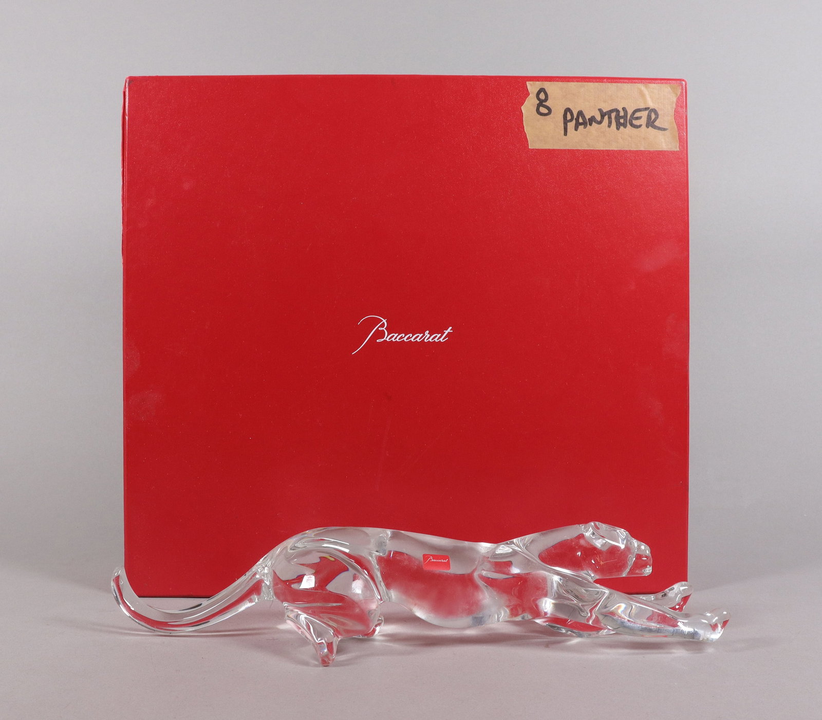 A Baccarat crystal panther with original box: A Baccarat crystal panther with original box. H: 2.5" x W: 13.5."