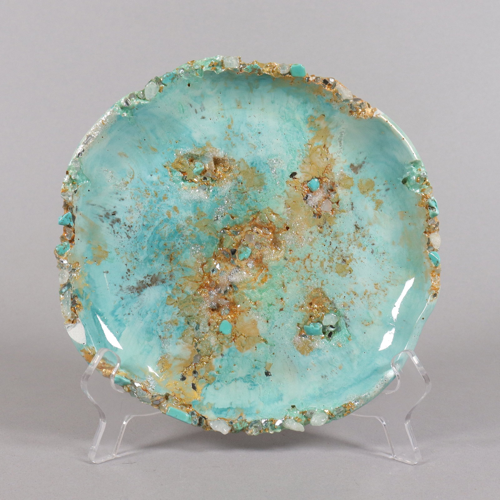 A turquoise glazed saucer: A turquoise glazed saucer, from an estate. H: 1" x W: 7.25."