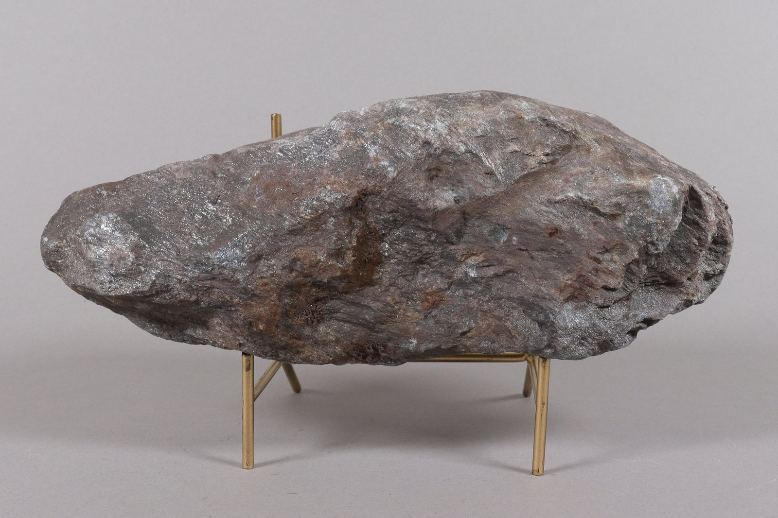 A large possible meteorite boulder: A large possible meteorite boulder. From an estate. H: 2.5" x W: 11."