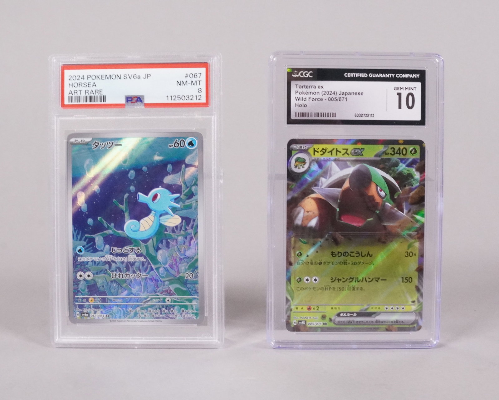 2 Pokemon cards graded: 2 Pokemon cards, graded by PSA and CGC.