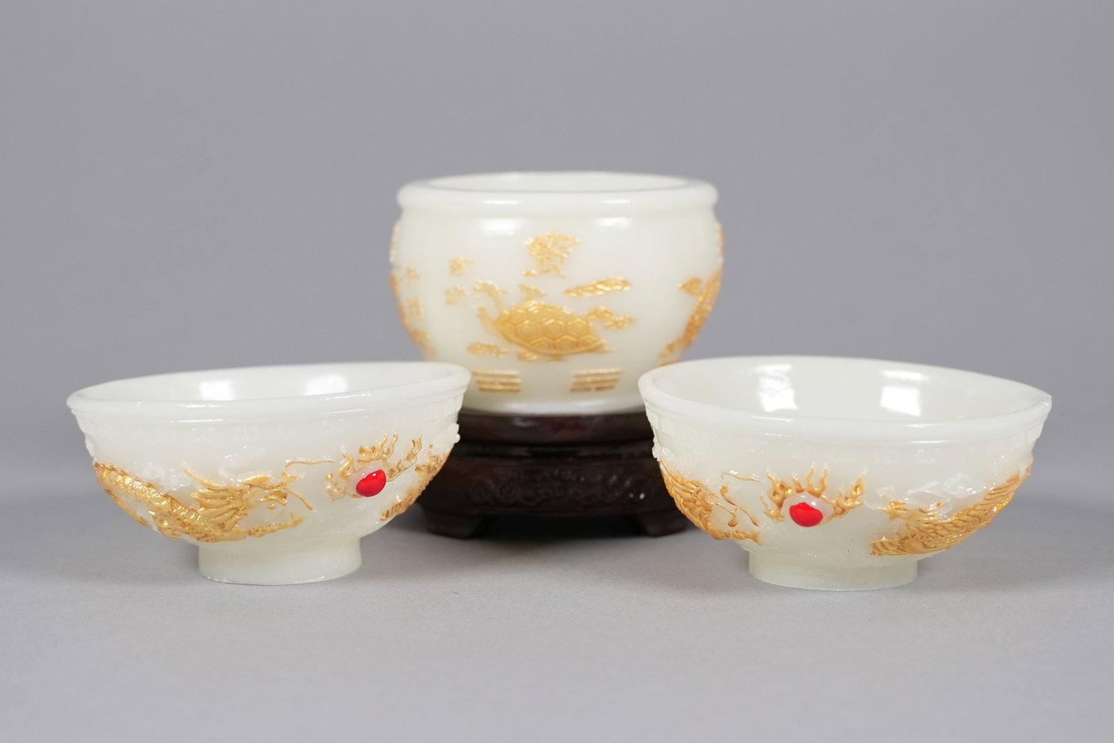 3 Chinese fine carved cups: 3 Chinese fine carved cups, largest H: 2.5" x W: 3.7."