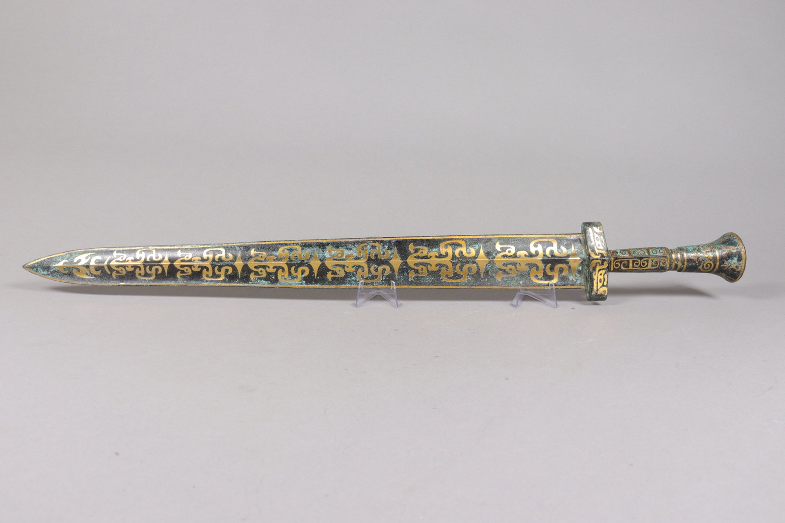 Chinese long gilted bronze sword: Chinese long gilted bronze sword. L: 26" x W: 3."